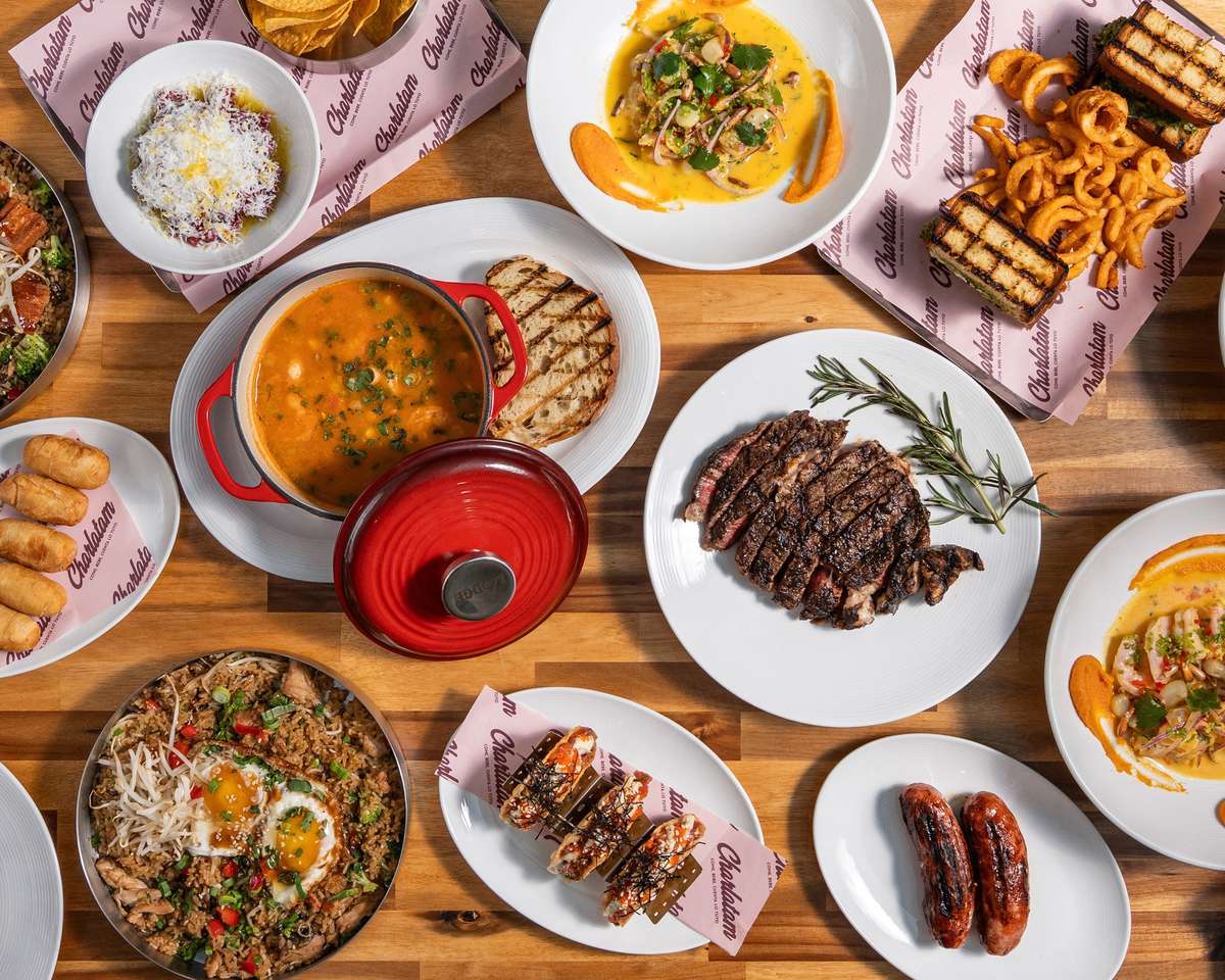 Family-style restaurant feast featuring grilled meats, pasta, appetizers, and shareable comfort food favorites.