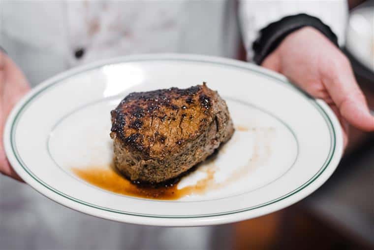 piece of steak displayed on a plate