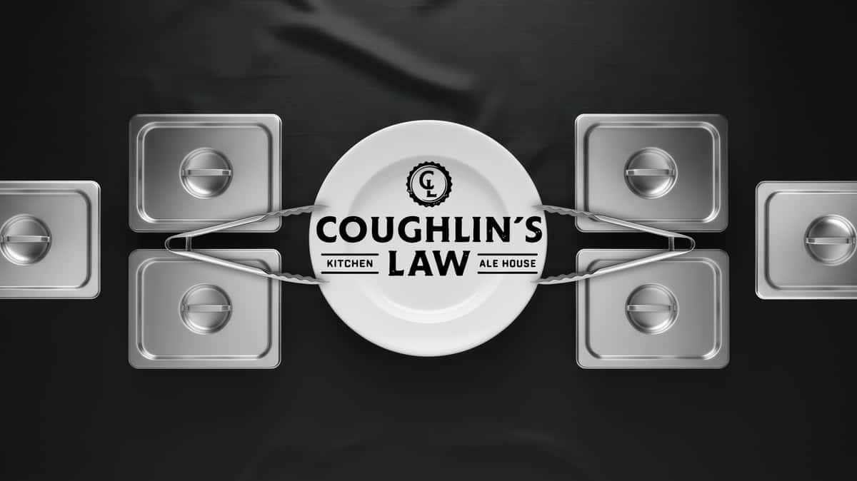 Coughlin's Law Kitchen and Ale House catering logo displayed on a white plate with serving pans and tongs promoting full-service Pittsburgh catering at this Mount Washington restaurant with a scenic view.