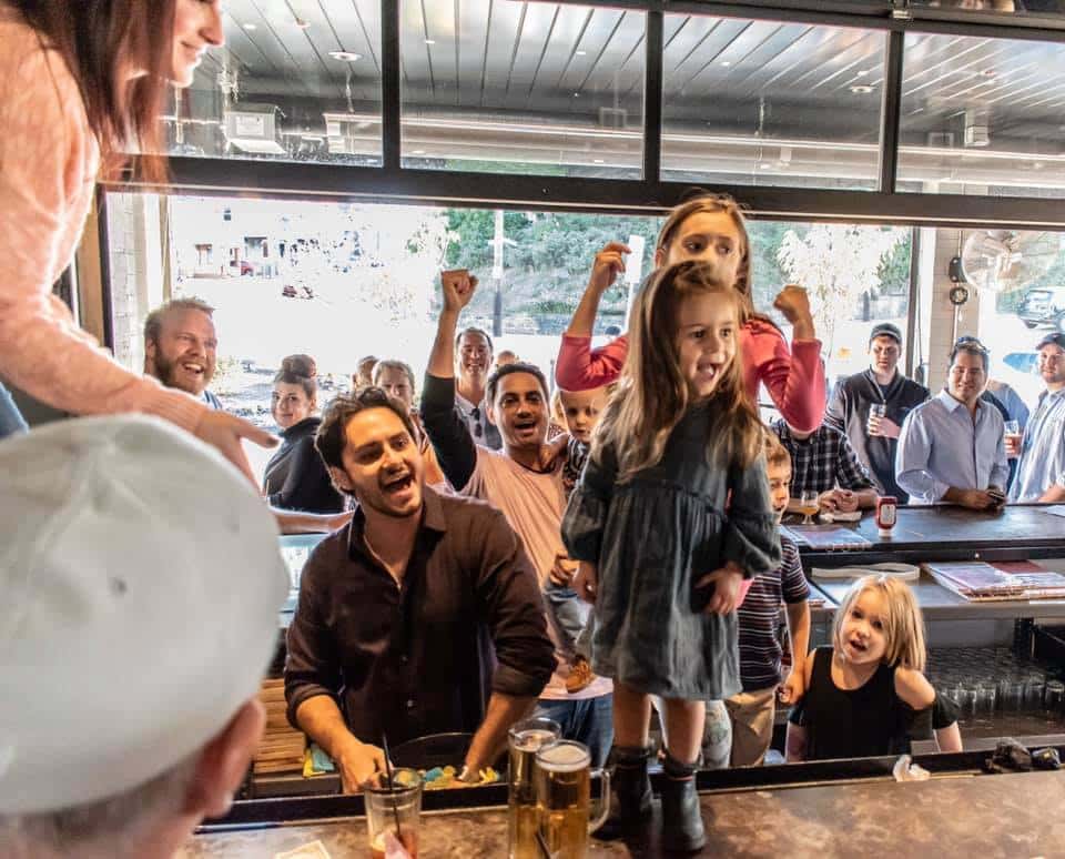 Children annoucing raffle ticket winners at Coughlin's Law Kitchen and Alehouse in Pittsburgh's Mount Washington during their Breast Cancer Awareness Charity Event