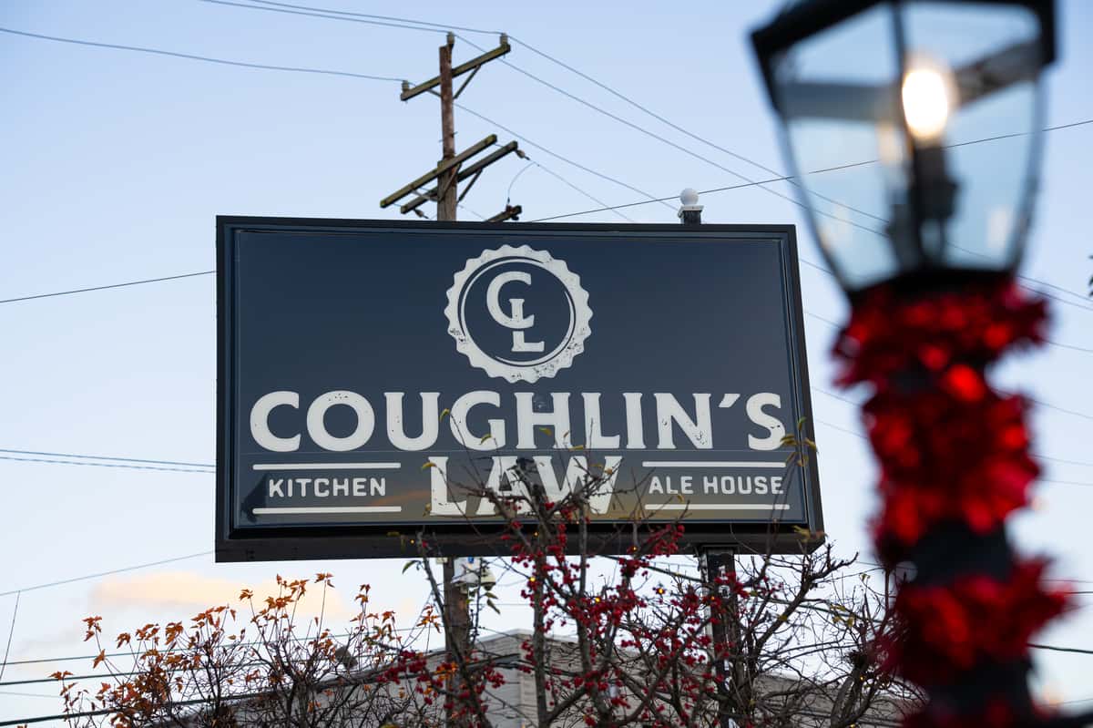 The outdoor signage decorated for Christmas at Coughlin's Law Kitchen and Alehouse, Restaurant in Mount Washington: Restaurants Pittsburgh