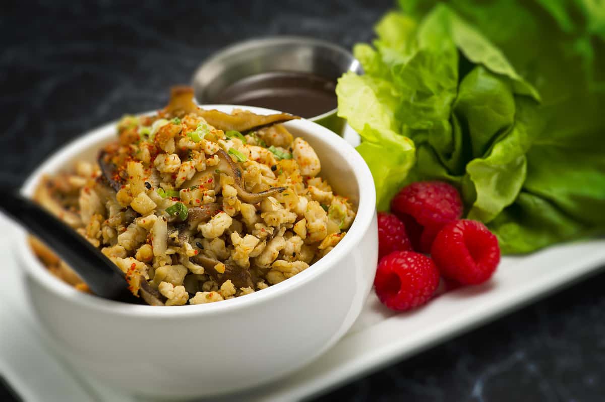spiced rice with fish mixed in served with a brown sauce