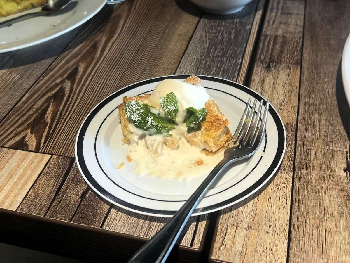 Pie partially eaten on a plate