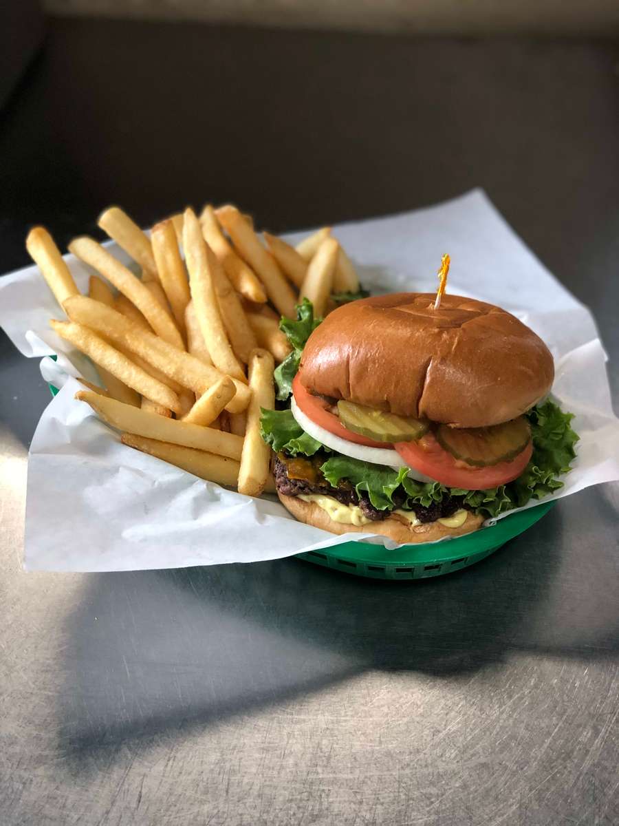 Our burgers, are a hand formed 6 oz. ground chuck patty served with lettuce, tomato, onions, pickles and our popular Spar goop