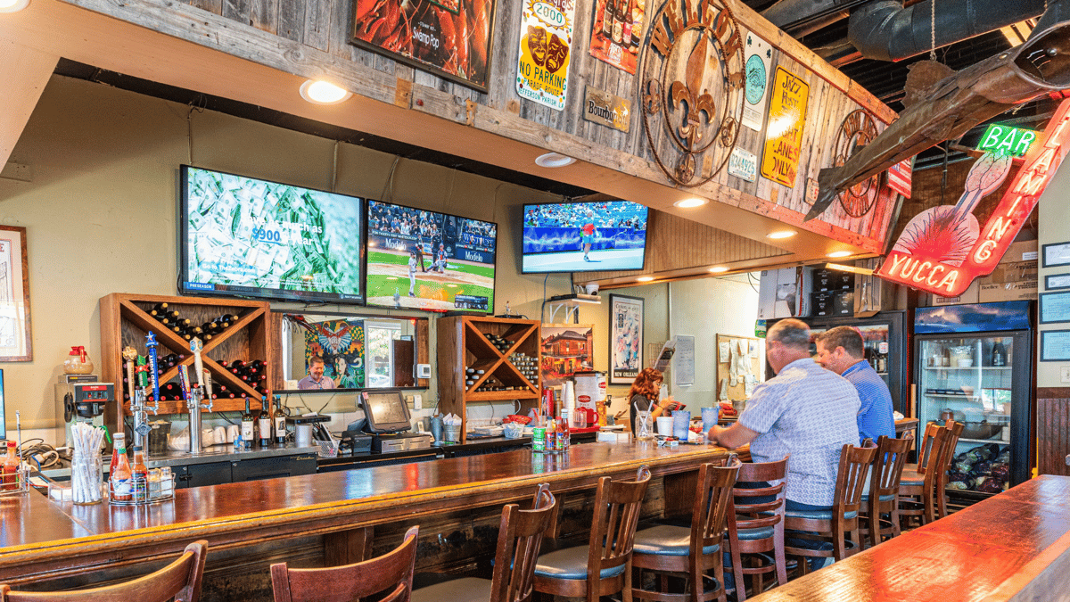 Unwind in the Bar Area at Charlie's, featuring a vibrant atmosphere, handcrafted cocktails, and an extensive drink menu. Elevate your dining experience at Charlie's Creole Kitchen.