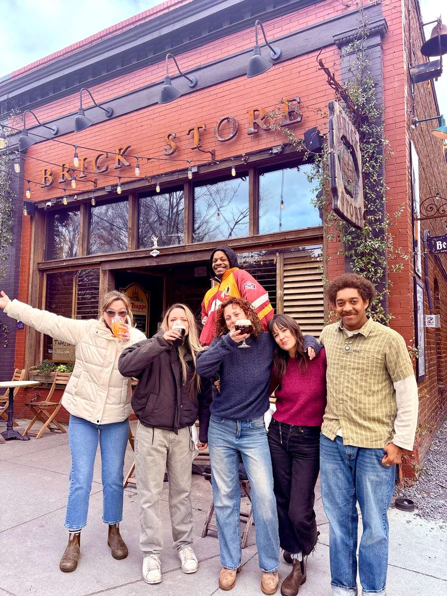 our staff outside the pub drinking beers