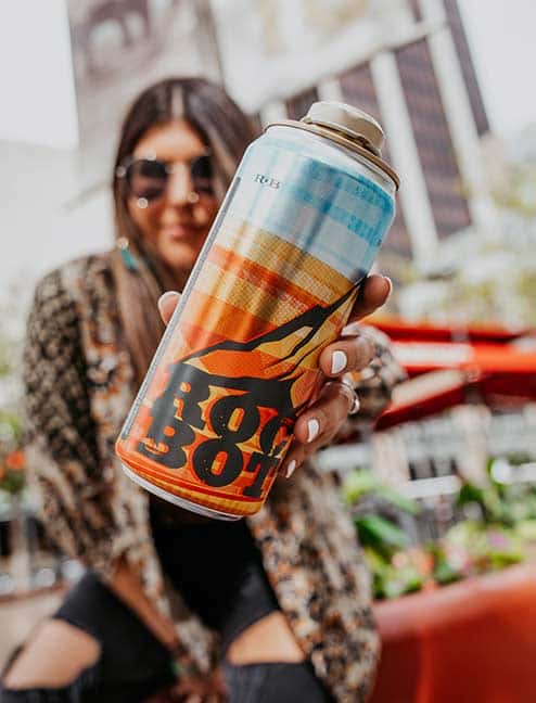person with a can of beer