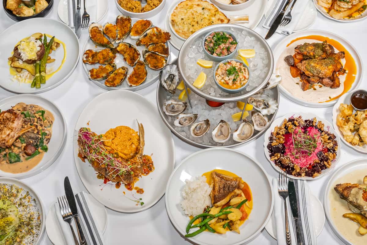 Group shot of food including oysters and other seafood.