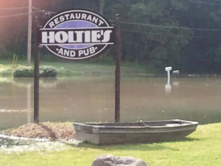 front sign and a small boat out front during the flood.