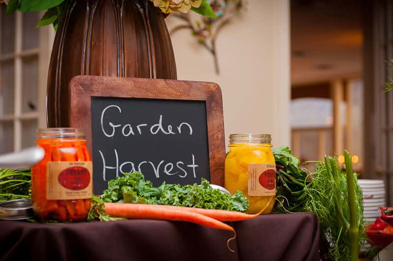 garden harvest sign on a table with vegetables