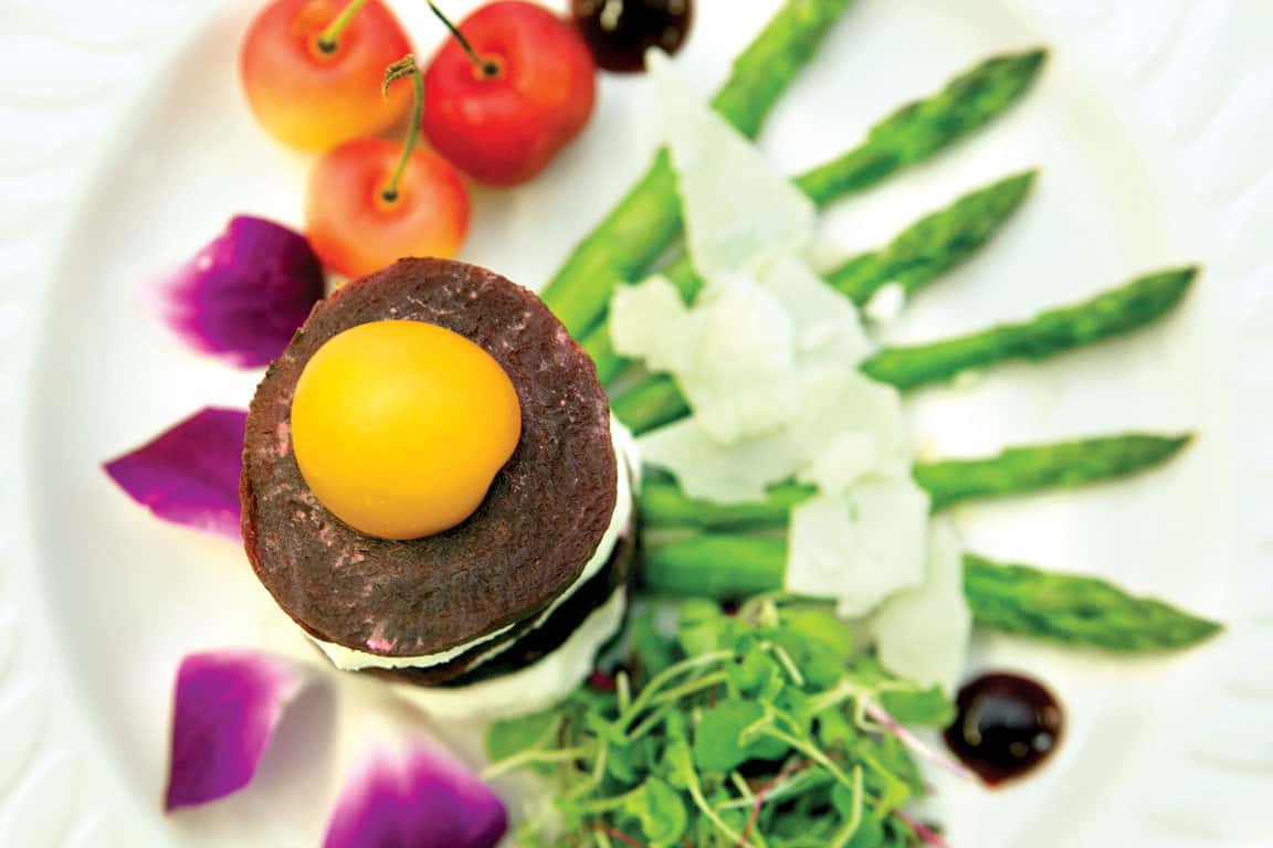 plated dish with asparagus and mixed greens