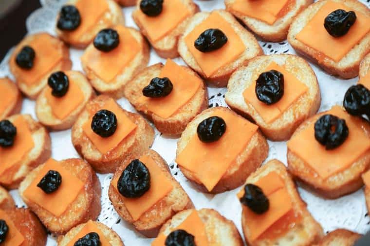 crostini topped with cheese and fruit