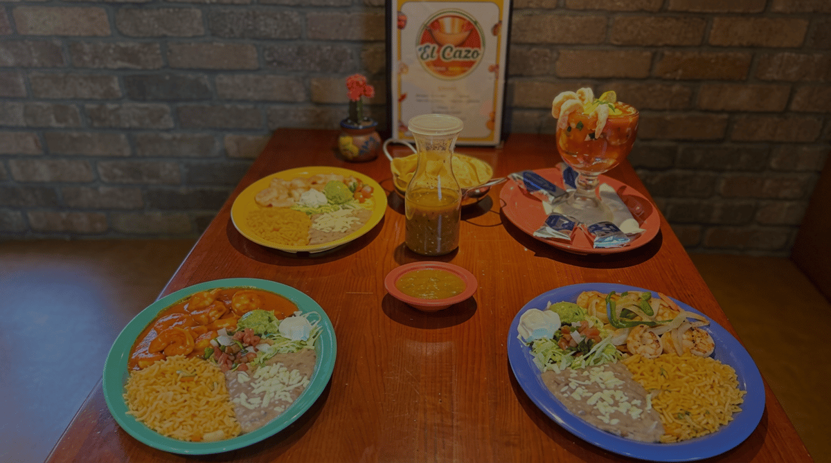 Signature Mexican dishes at El Cazo Mexican Restaurant featuring shrimp entrées, rice, refried beans, fresh salad, shrimp cocktail, chips and salsa, and house-made salsa in a warm dining atmosphere.