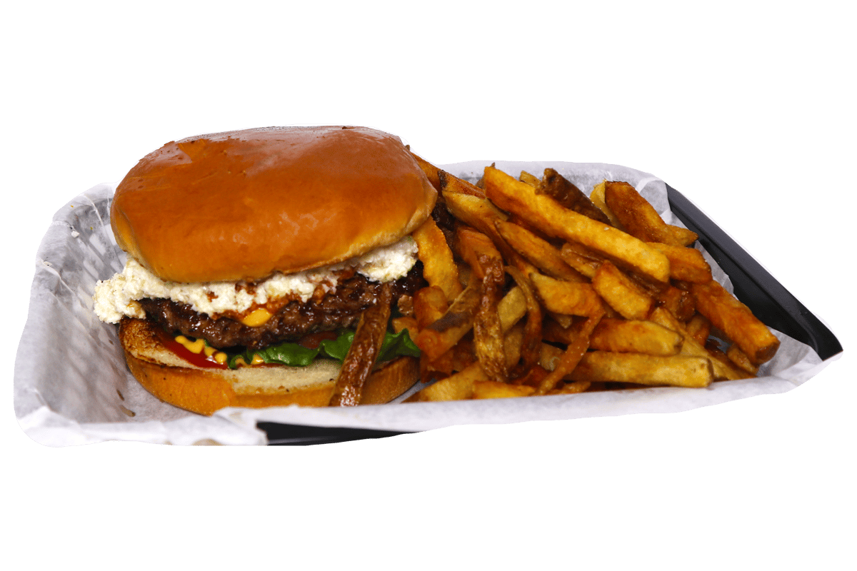 Hangry's Grill's juicy hamburger with melted cheese sits beside a pile of golden french fries.
