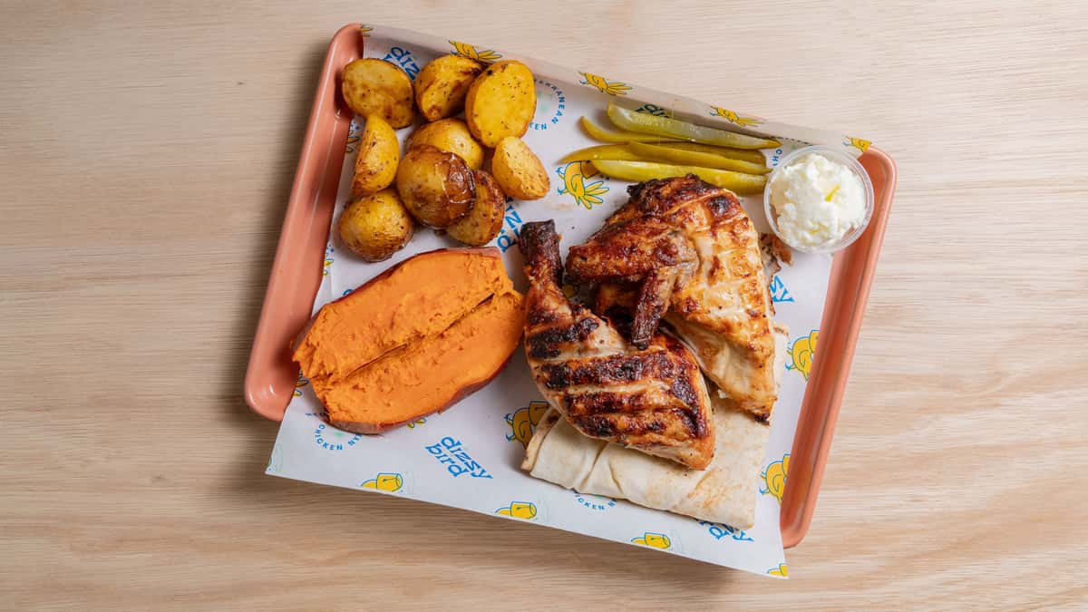 Half of a Rotisserie Chicken, with one breast & wing piece and one thigh & drumstick piece. Choice of two sides. Served with pita bread, garlic sauce and pickles