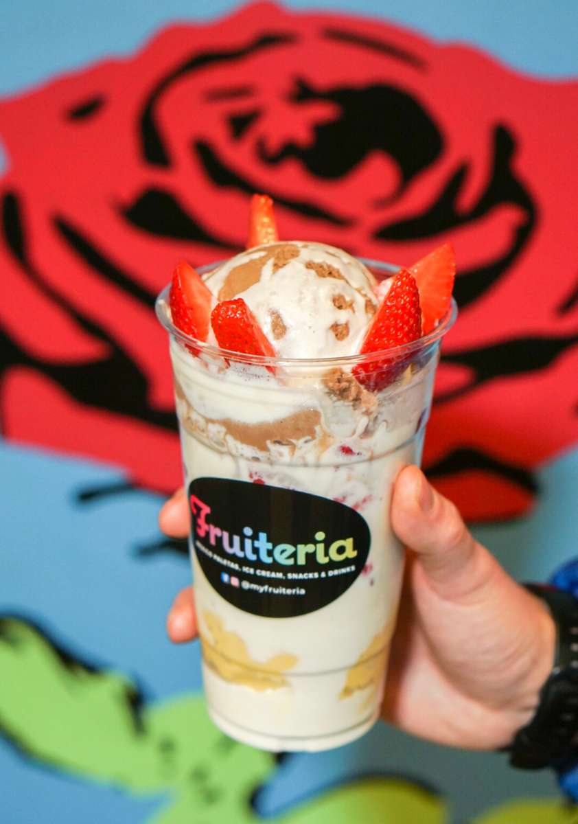 Chocolate ice-cream cup with strawberry slices