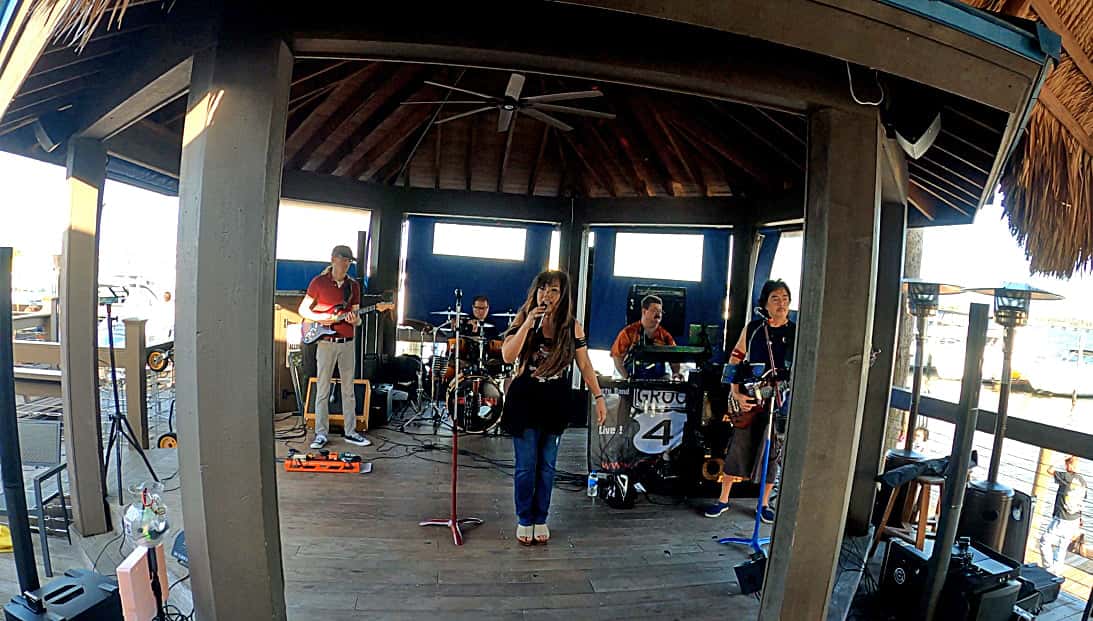 Full band performing on stage
