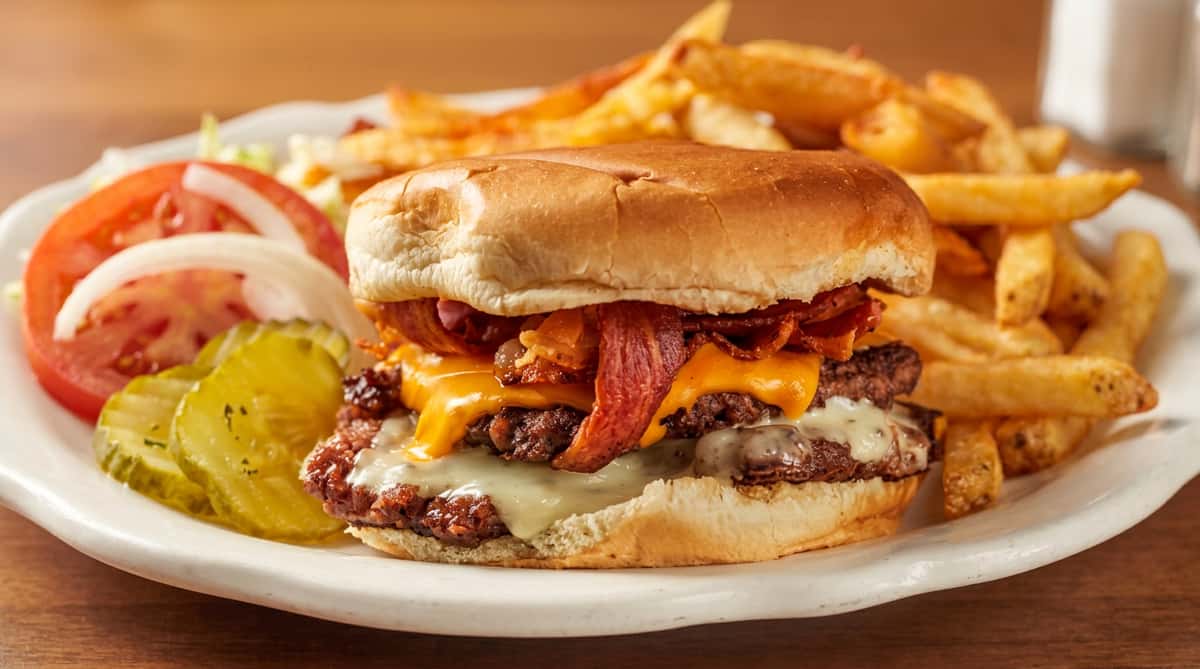 Double cheeseburger with bacon, melted cheddar and provolone, served with fries and a pickle.