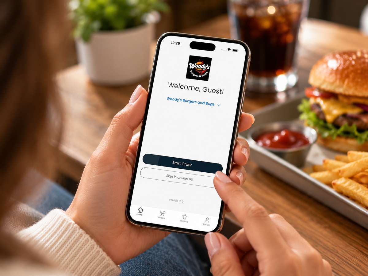 person holding phone with app