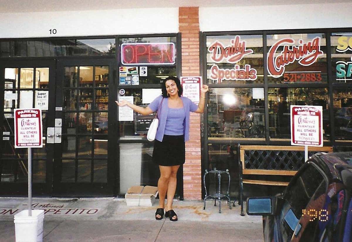 Woman taking a picture in front of the restaurant