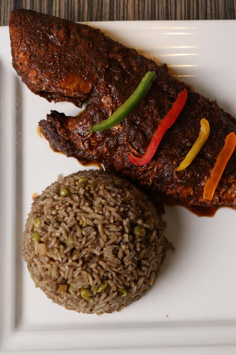 Fresh, whole red snapper marinated in our signature jerk seasoning and grilled to perfection. Served with a balance of smoky heat and island herbs, this dish delivers authentic Caribbean flavor in every bite — crispy on the outside, tender and juicy inside.