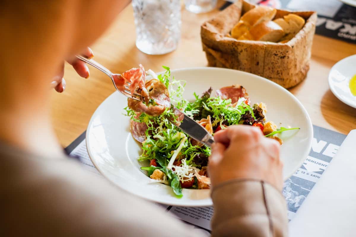 Woman eating salad