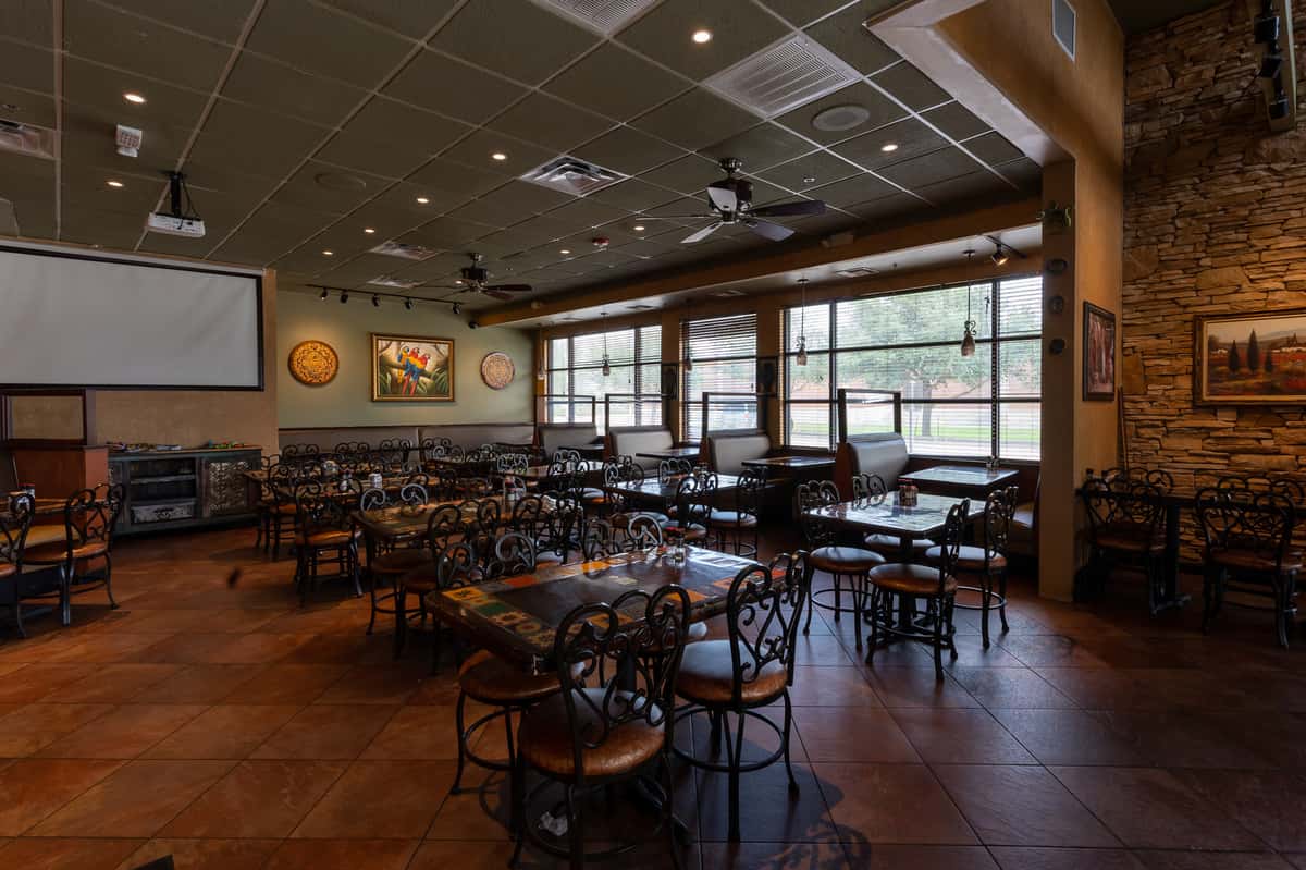 Interior dining room filled with tables and chairs