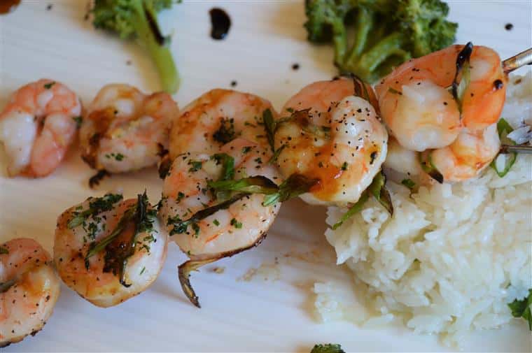 Shrimp on skewers with rice and broccoli