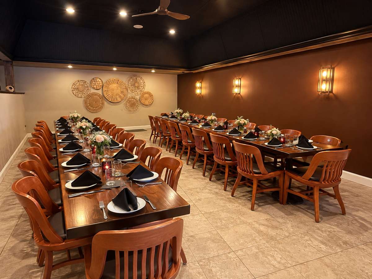 Fiamata's private dining room set with long tables for a party