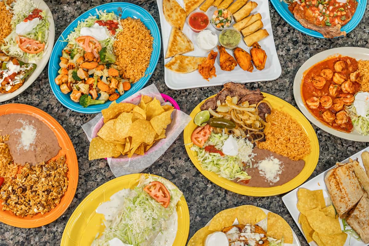 Group shot of food including rancheros, nachos and more