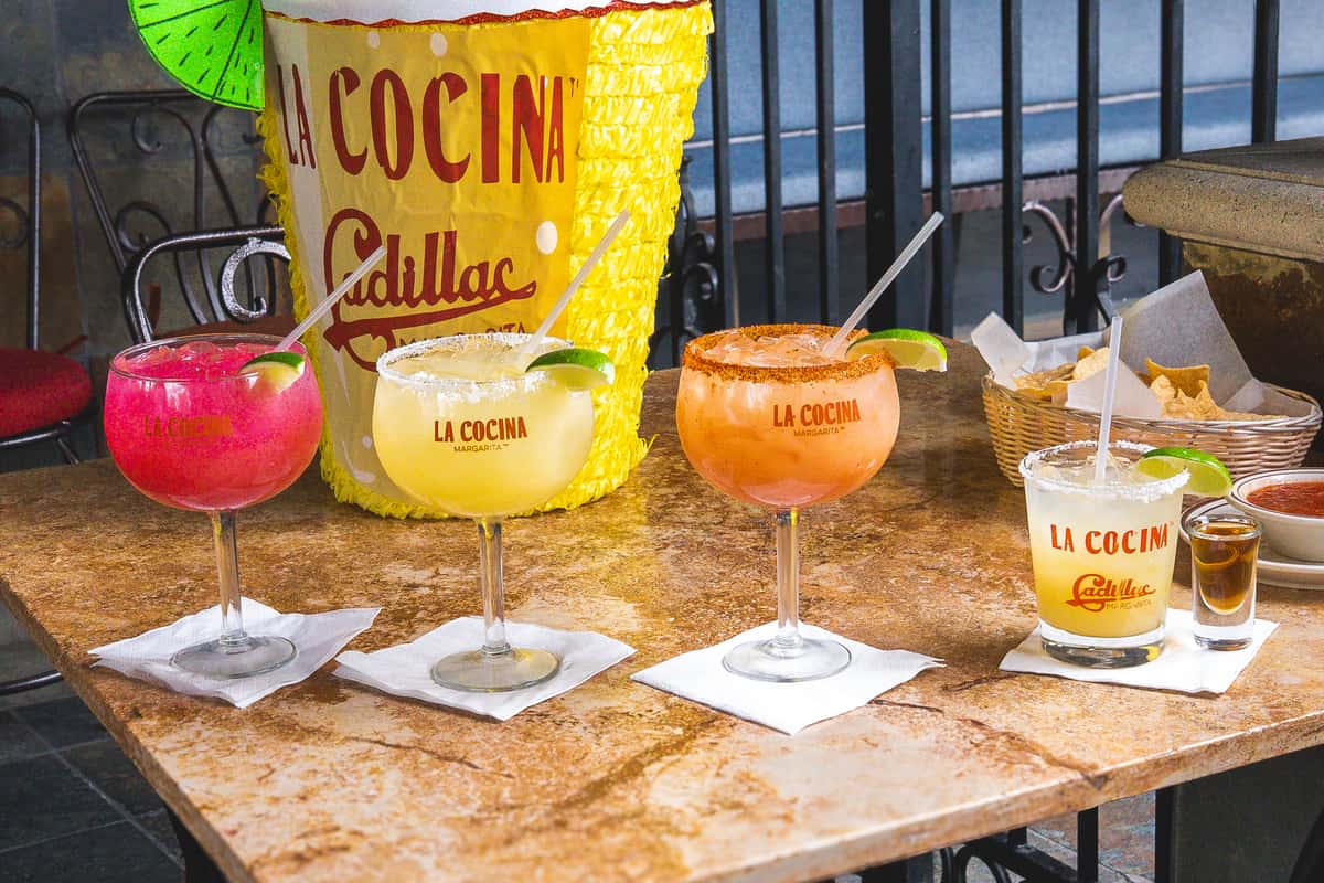 Big Margaritas and a Cadillaca margarita lined up on a table outside