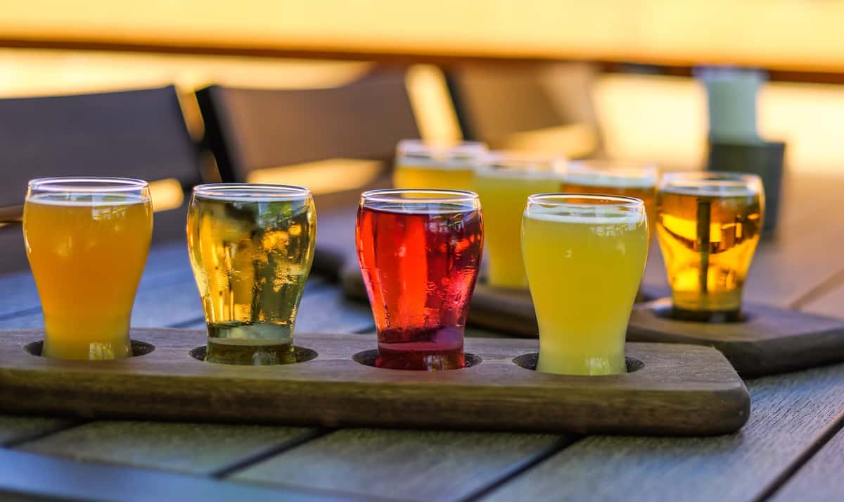 A flight of four colorful craft beers from Farmers Brewing Co.