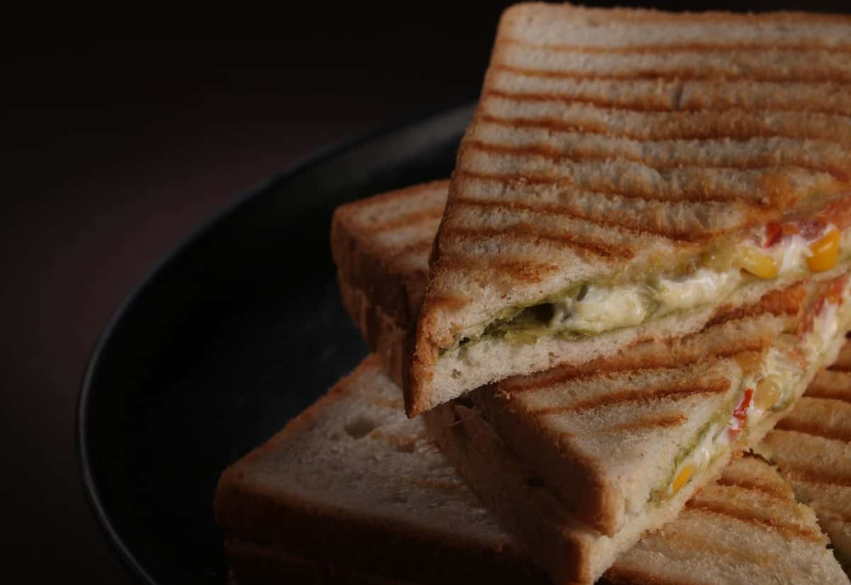popmenu-close-up-of-a-toasted-sandwich-filled-