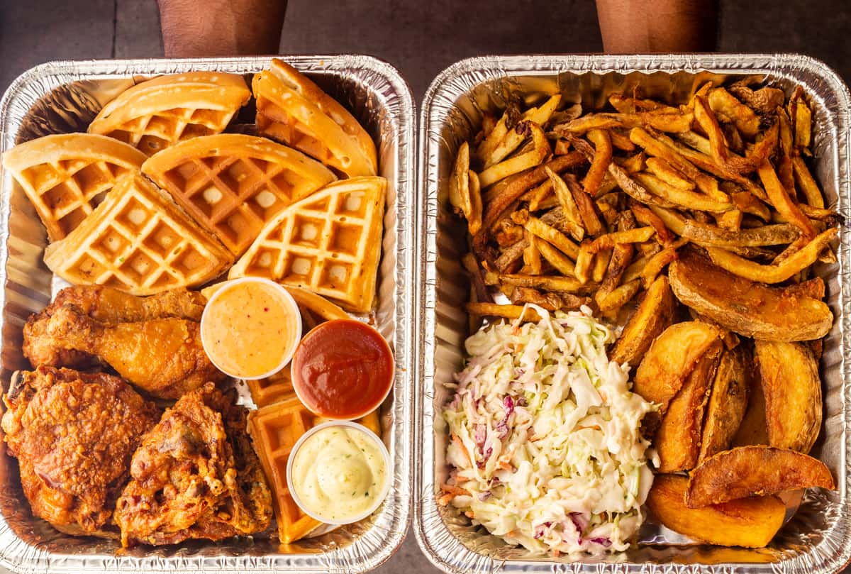 Catering Trays filled with chicken, waffles and fries