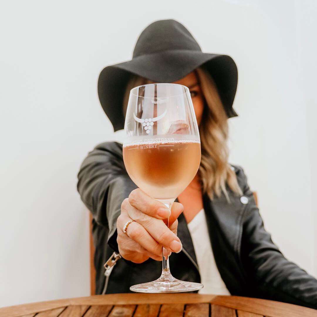 cheers woman holding wine glass