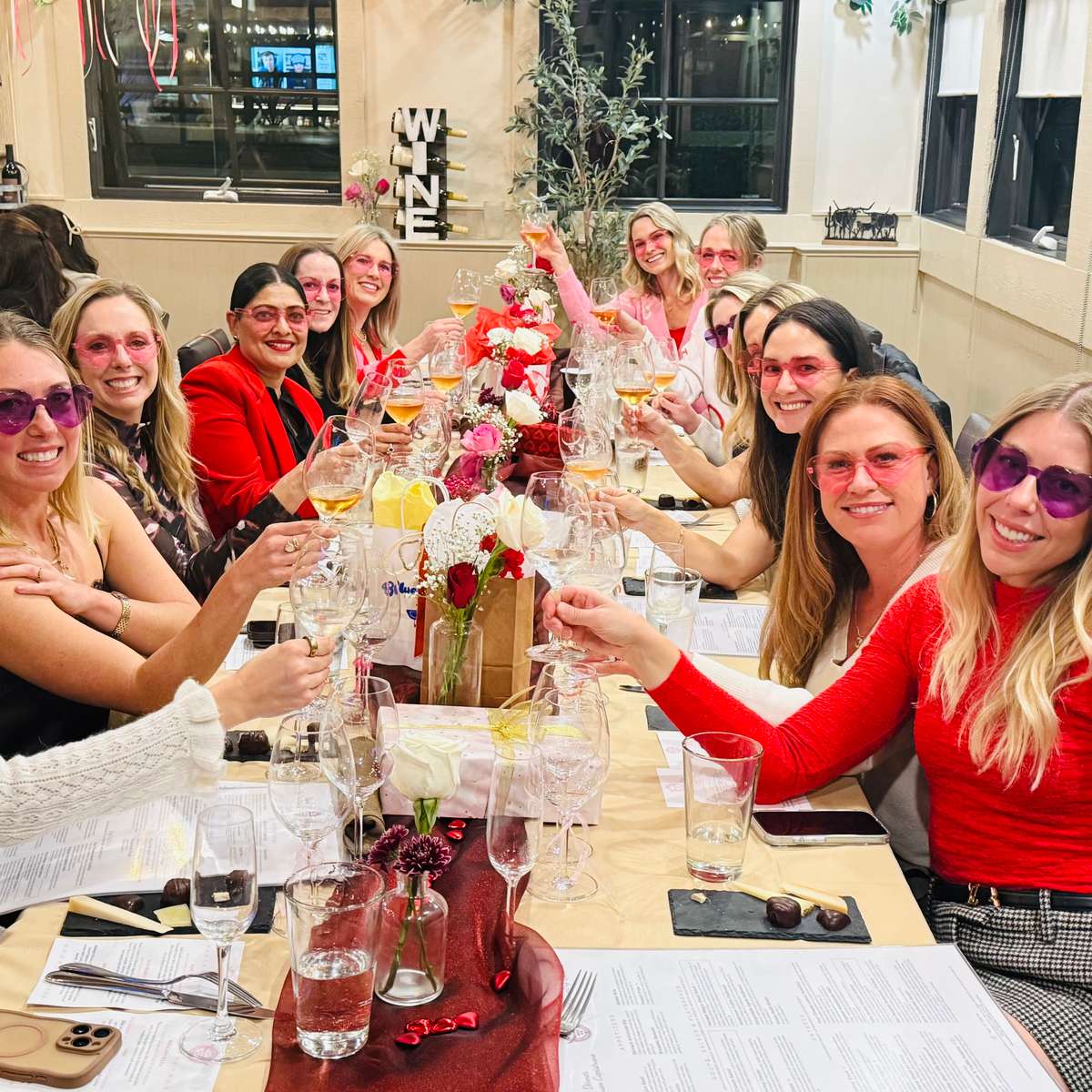 ladies toasting at outdoor event