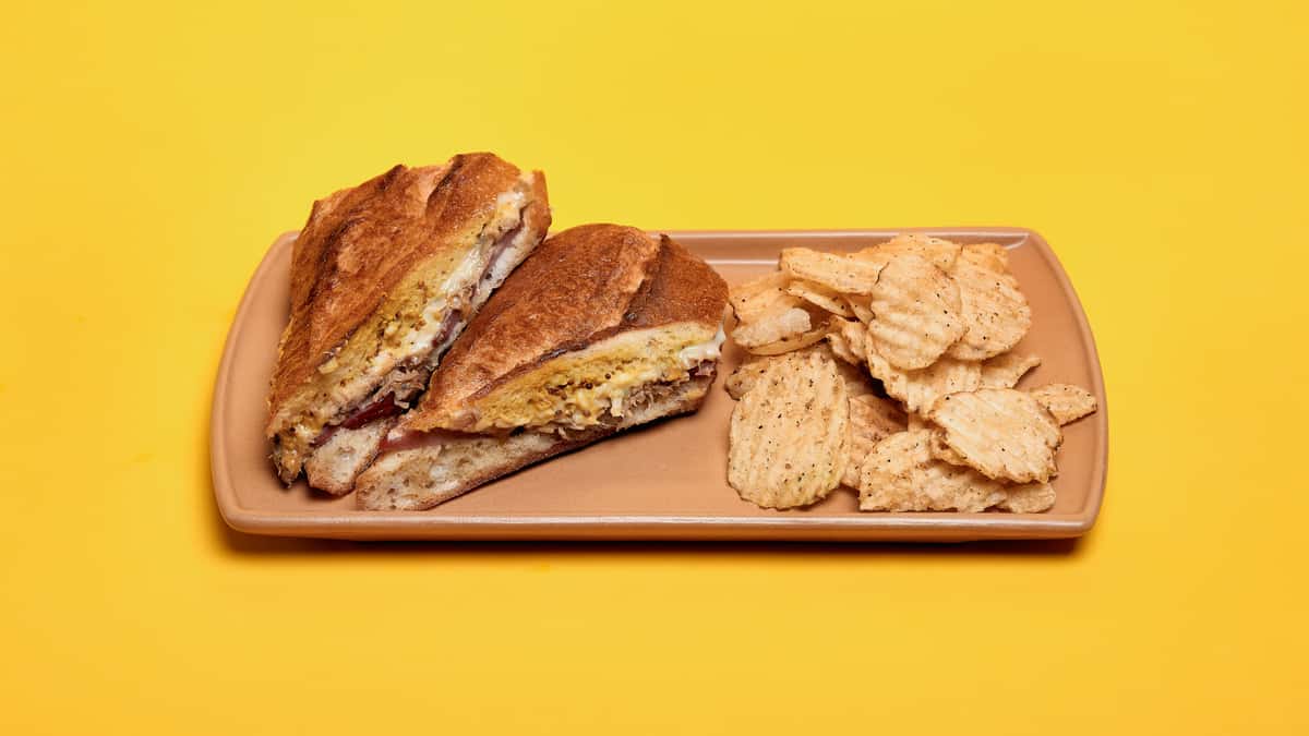 Lost & Found OTR's house made Cubano served with hen of the woods chips.