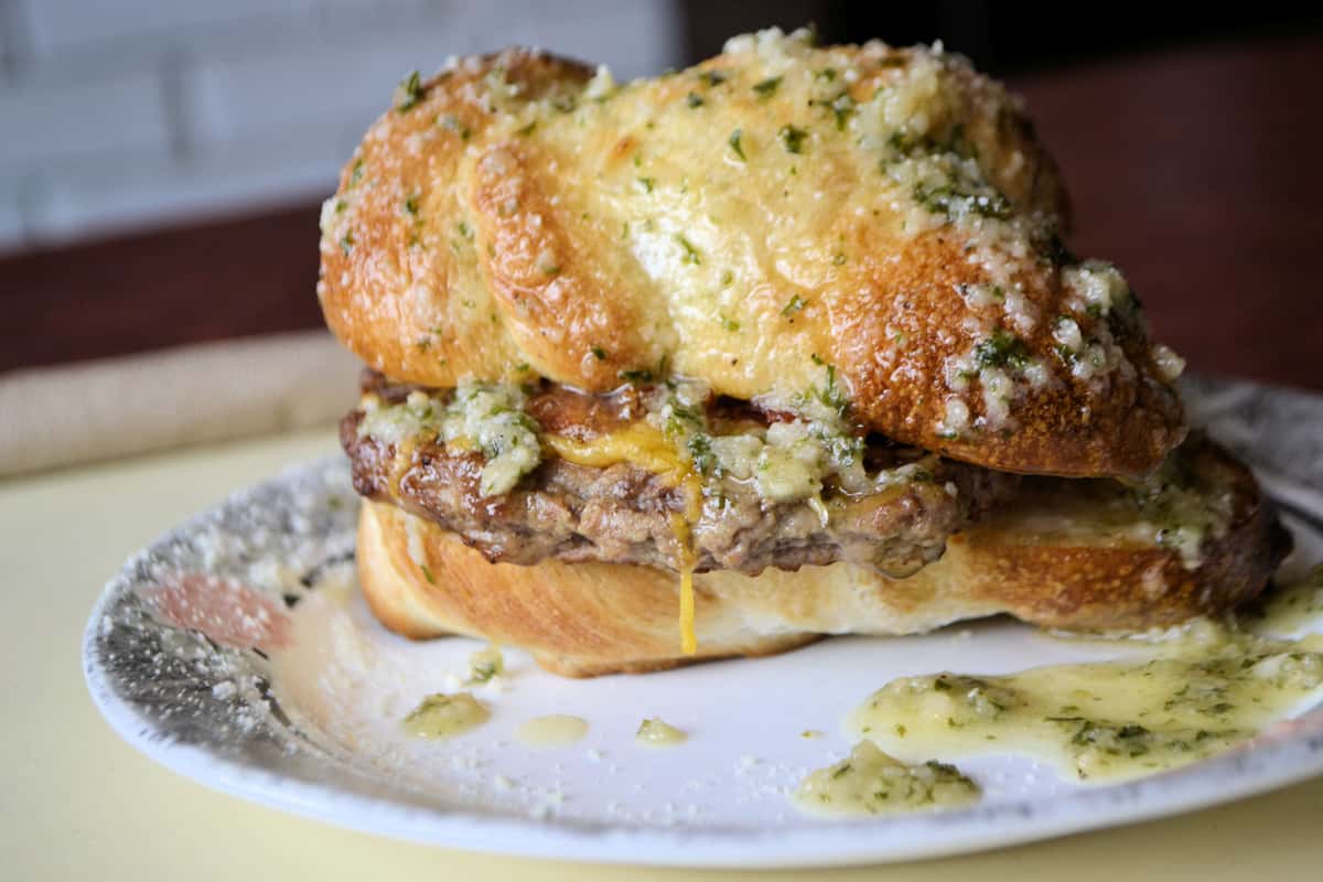 A burger served on a garlic knot, made in house, choose from 3 different kinds.