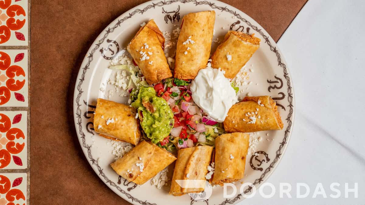fried tortilla rolls with salsa guac and dip