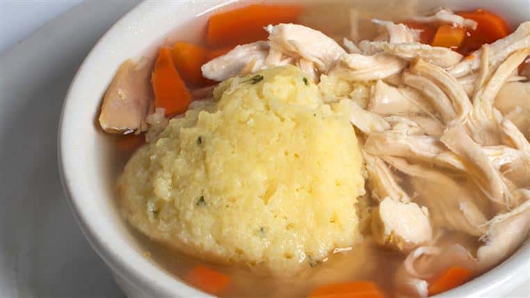 Mort's Famous Matzo Ball Soup: Homemade chicken soup with a delicious matzo ball in the middle. Served with or without noodles.