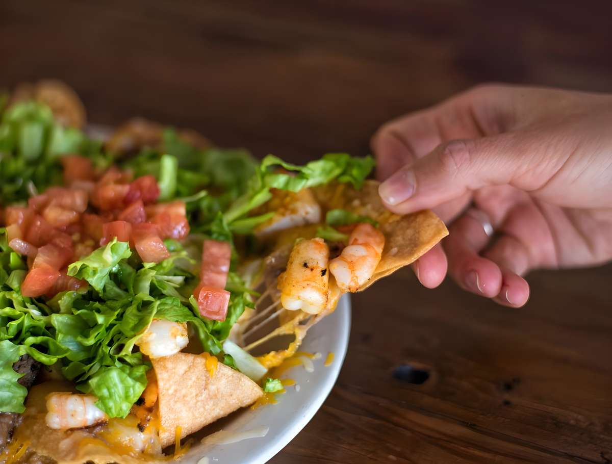 Grilled shrimp served over fresh greens and diced tomatoes.