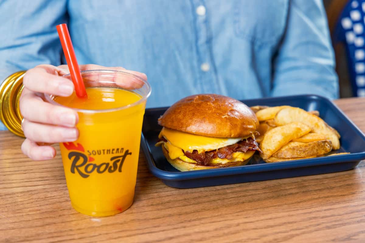 Breakfast sandwich with orange juice