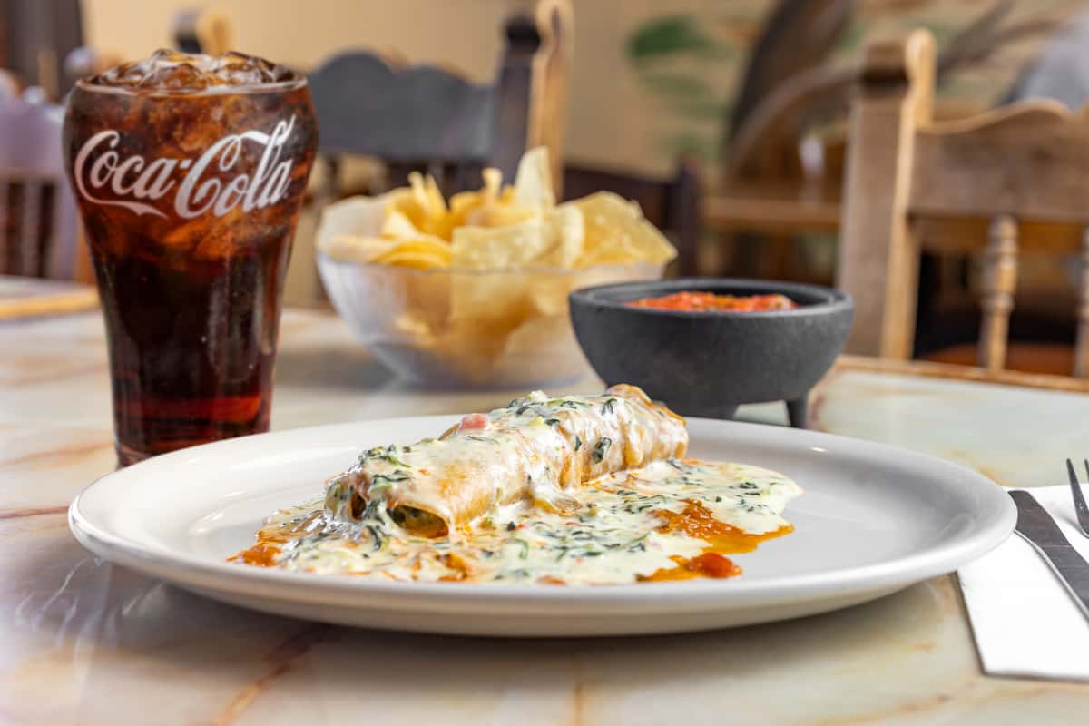 spinach enchiladas and coca cola glass