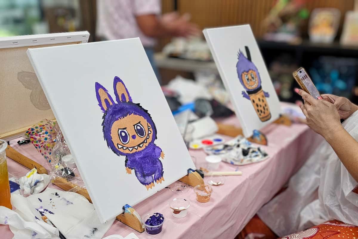 Guests enjoying a paint and sip event