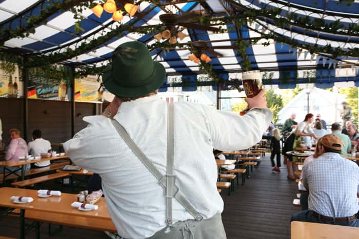 man holding glass of beer
