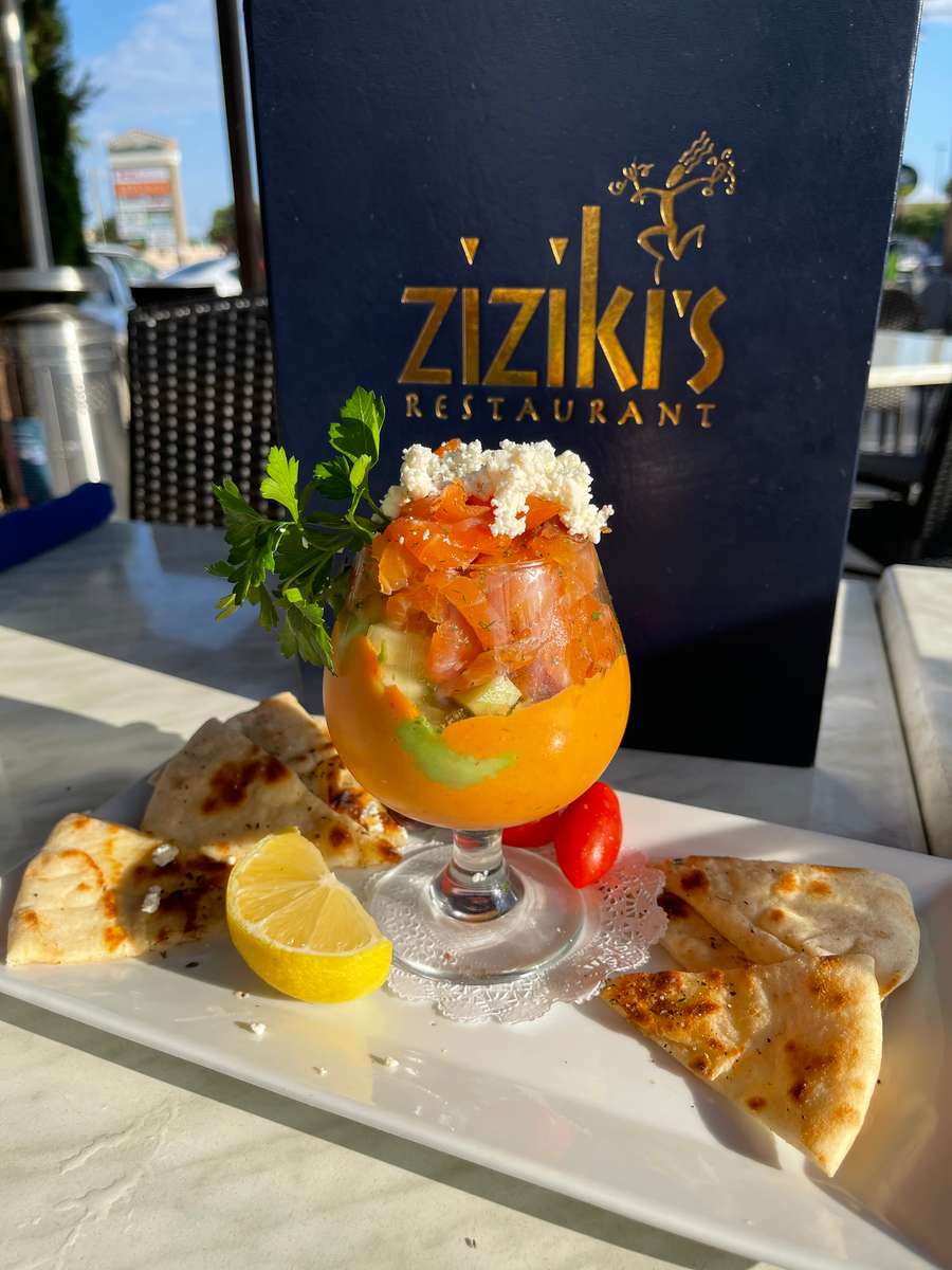 Smoked salmon and avocado layered in a glass, topped with feta and parsley, served with pita, lemon, at Ziziki's Restaurant