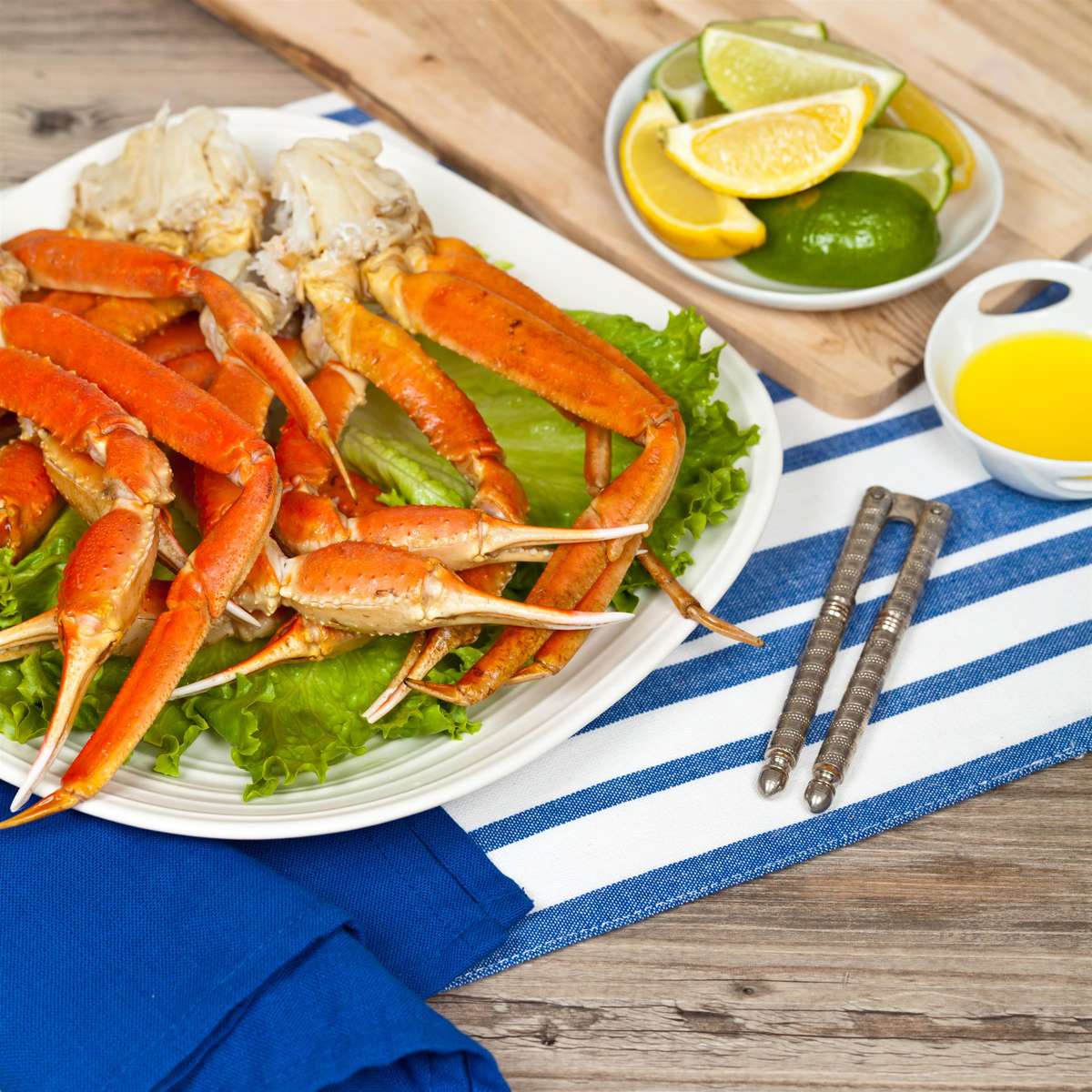 Crab legs with fresh lemon slices and butter sauce.jpg
