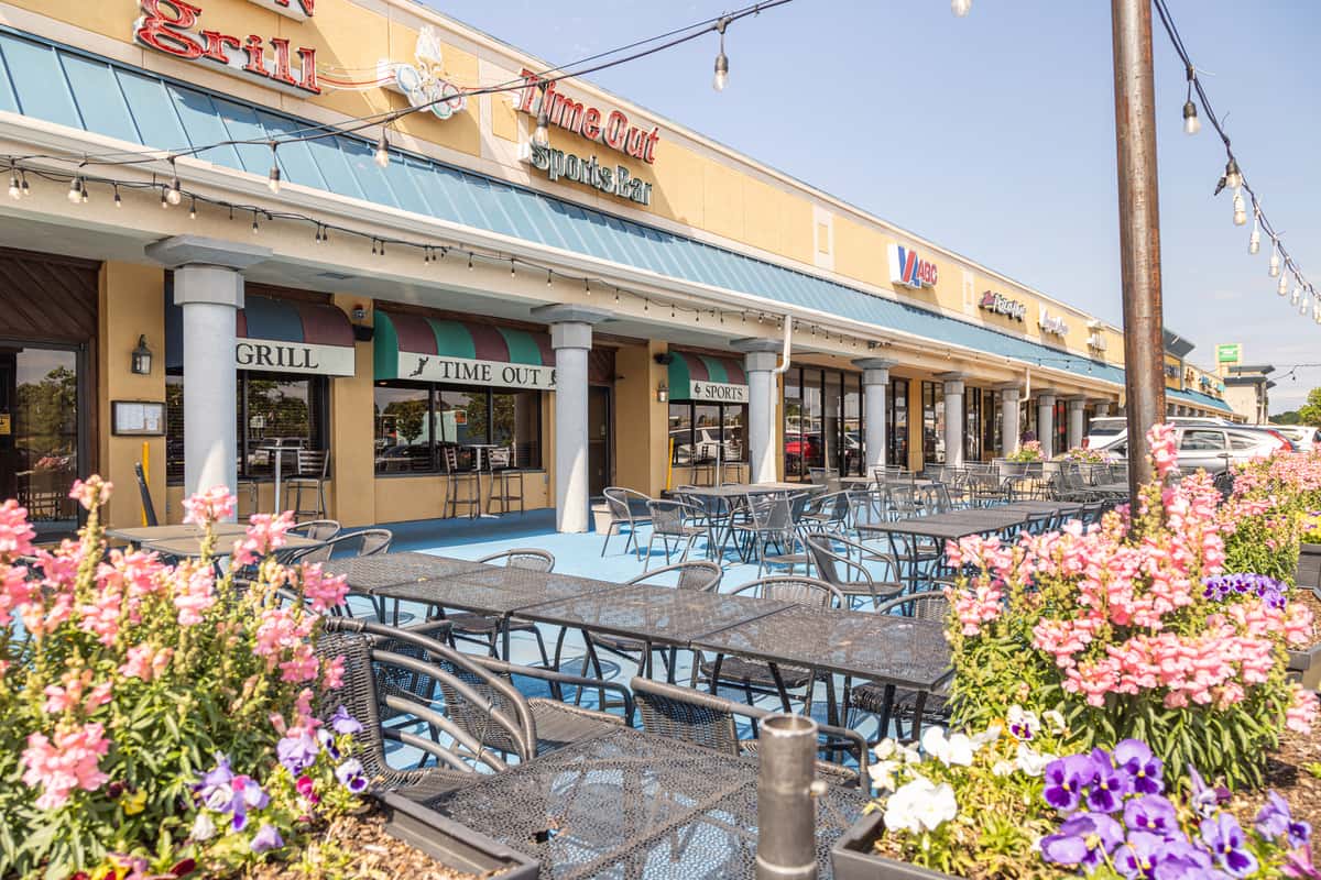 Restaurant exterior with flowers and outdoor seating
