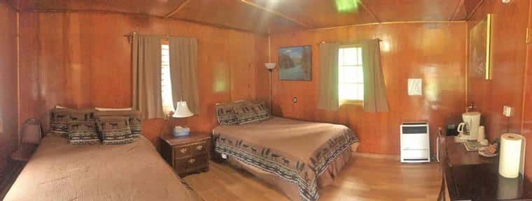 Willow log cabin with two beds, drawer, and heater