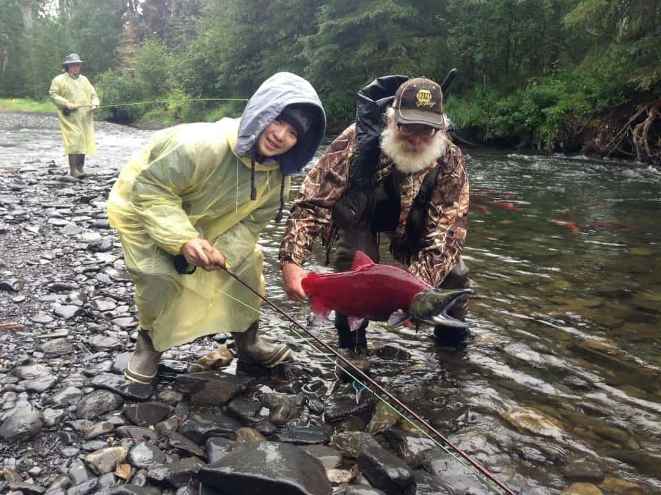kid and man with coho salmon